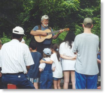 Tom Wisner entertains Hollywood Schools children and local residents at the annual Wade-In.